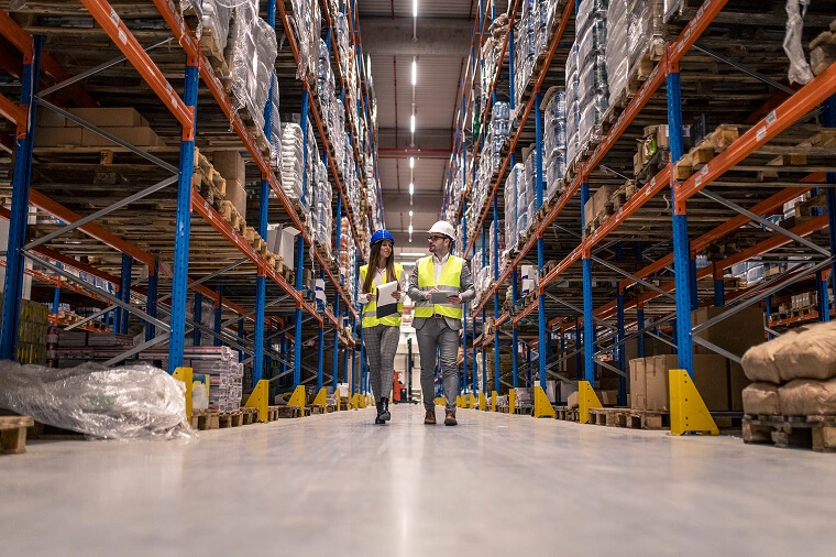 Refrigerated warehouse floor with racked pallets and ceiling evaporator units